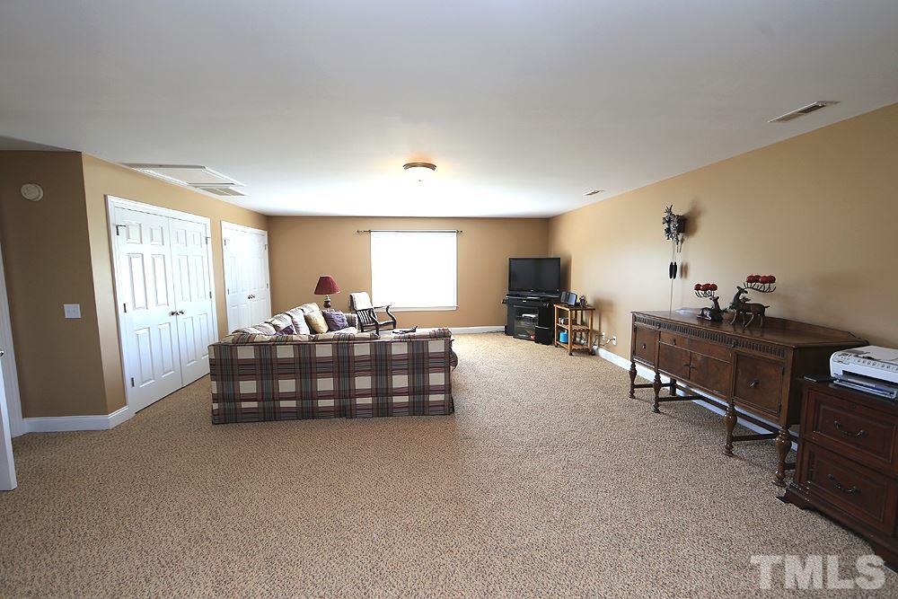 214 Steve Ridge Willow Spring, NC 27592 - Photo 24 of 29 a bedroom with furniture and a window