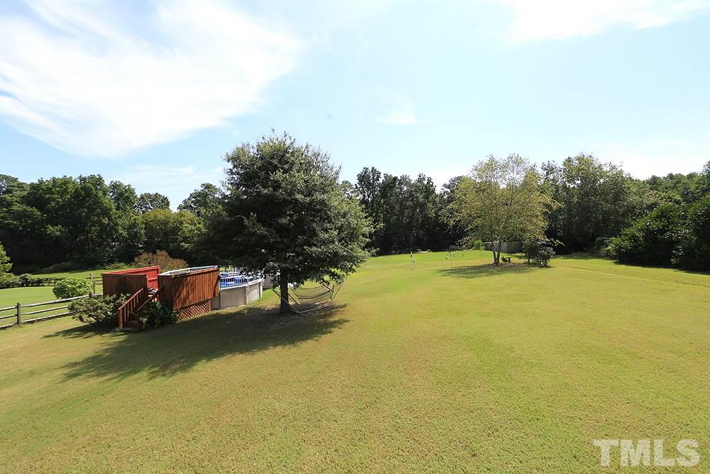 214 Steve Ridge Willow Spring, NC 27592 - Photo 26 of 29 a view of swimming pool with trees in the background