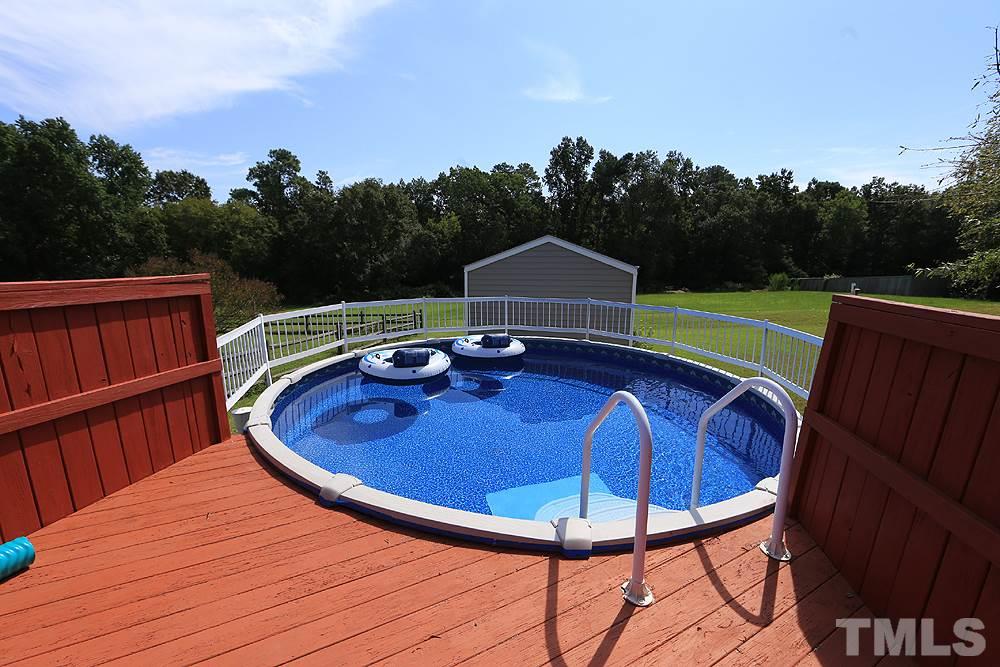 214 Steve Ridge Willow Spring, NC 27592 - Photo 27 of 29 a view of a chairs and table in the patio