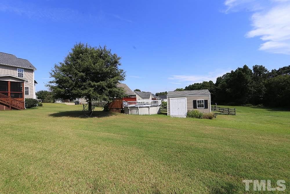 214 Steve Ridge Willow Spring, NC 27592 - Photo 28 of 29 a front view of a house with a yard