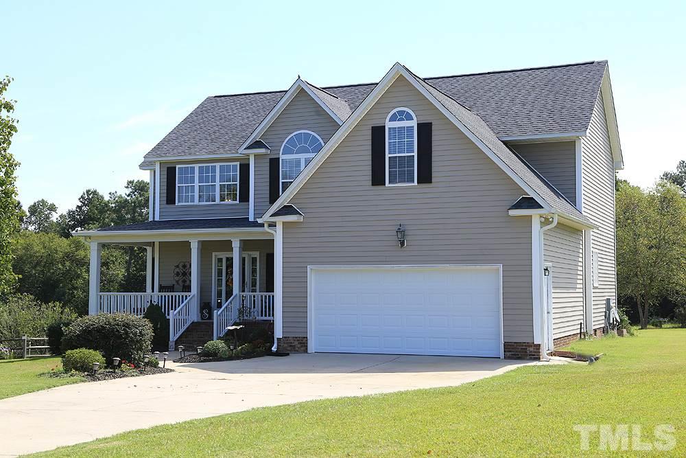 214 Steve Ridge Willow Spring, NC 27592 - Photo 29 of 29 a front view of a house with a yard