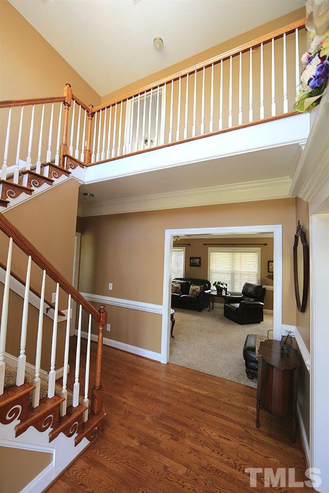 214 Steve Ridge Willow Spring, NC 27592 - Photo 4 of 29 a view of a livingroom with furniture and staircase