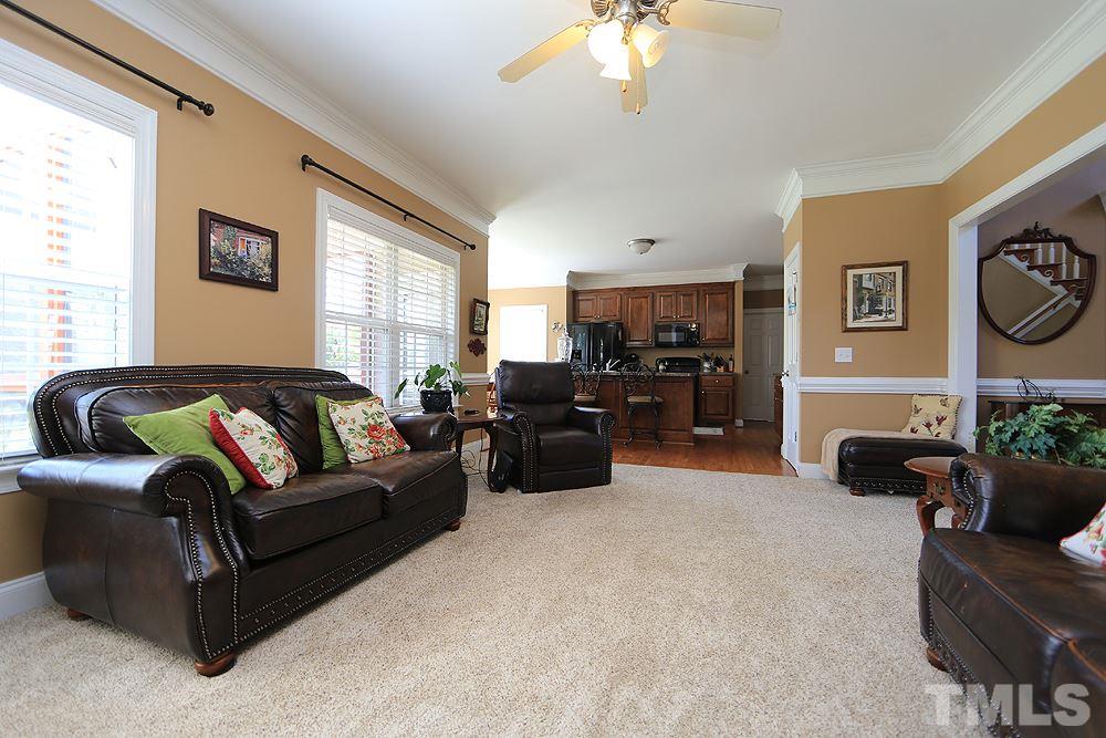 214 Steve Ridge Willow Spring, NC 27592 - Photo 9 of 29 a living room with furniture and a large window