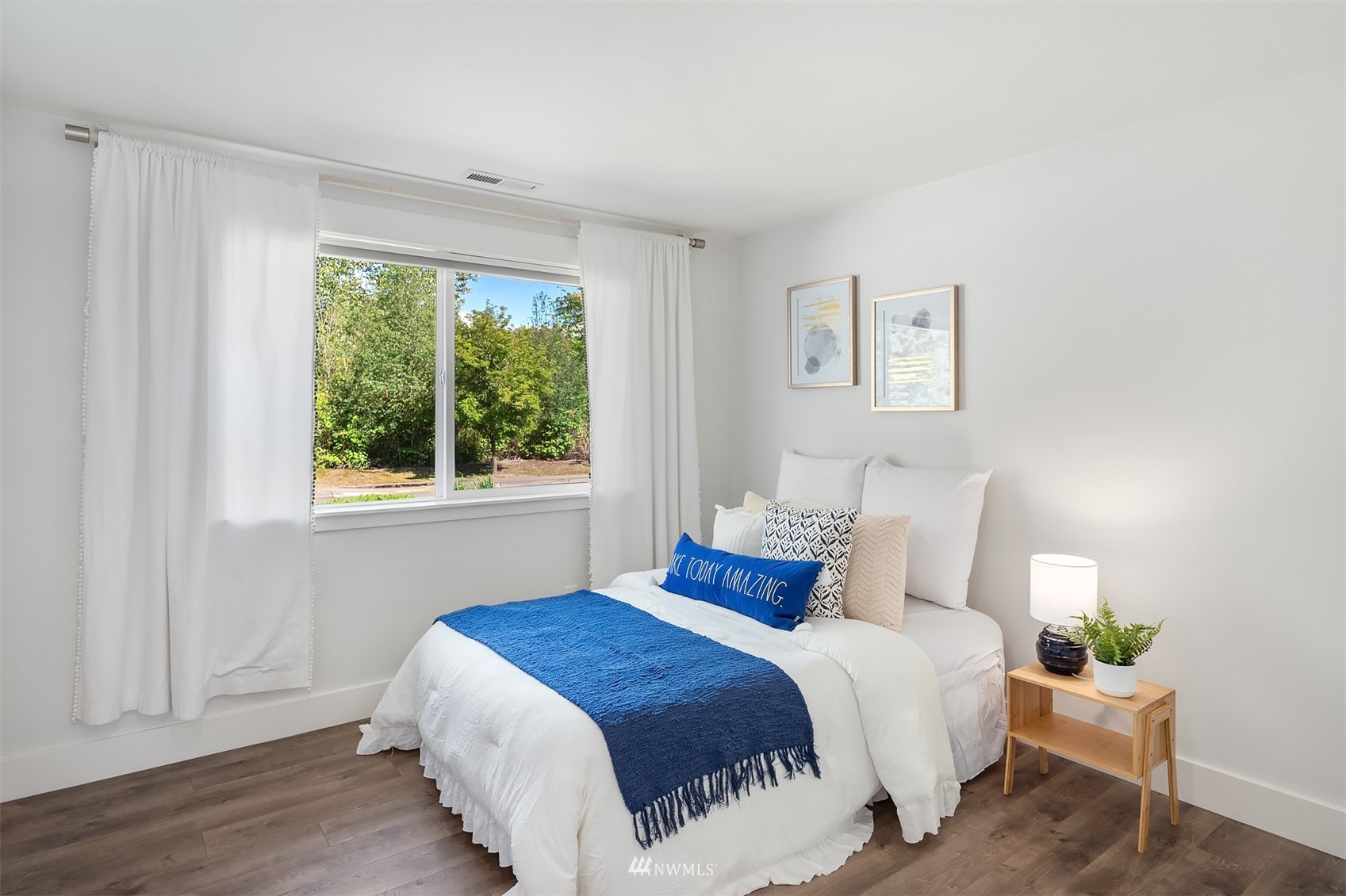 127 Hoquiam Avenue Southeast Renton, WA 98059 - Photo 13 of 26 a bedroom with a bed and window