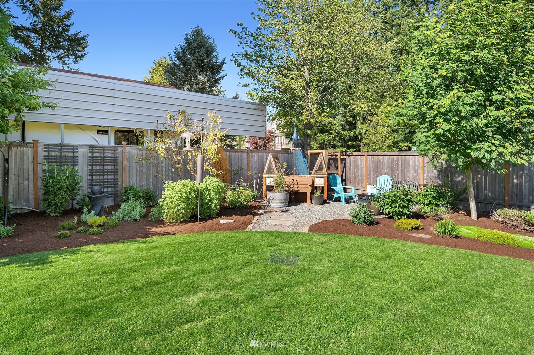 127 Hoquiam Avenue Southeast Renton, WA 98059 - Photo 24 of 26 a view of a house with backyard and sitting area
