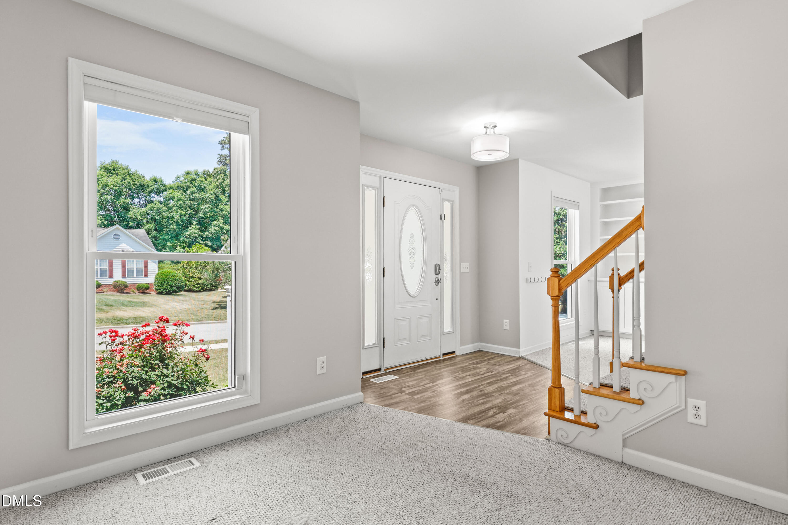 3015 Rennit Court Raleigh, NC 27603 - Photo 5 of 40 a view of an entryway with wooden floor