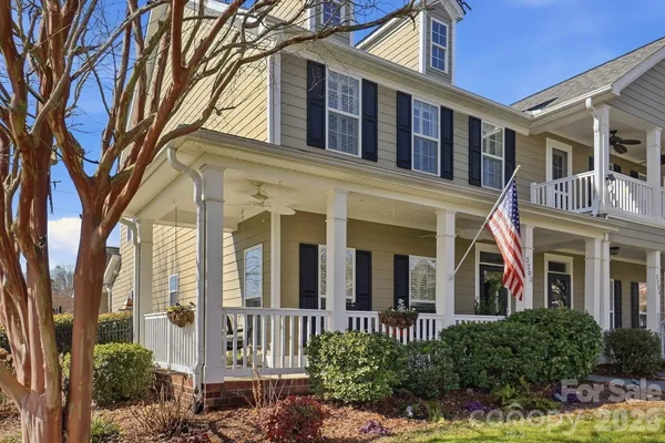 front view of a brick house with a large windows