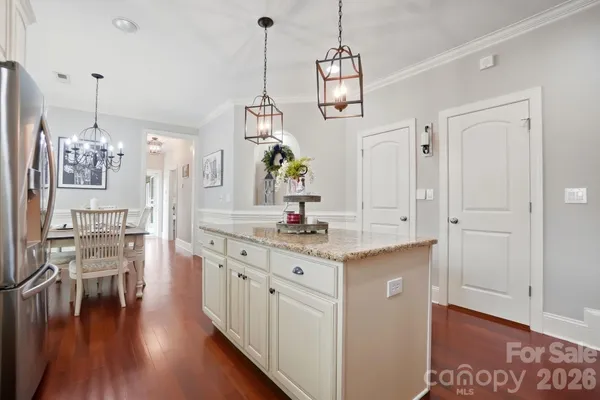 a kitchen with stainless steel appliances granite countertop a stove sink and cabinets