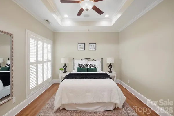 a bedroom with a large bed and a window