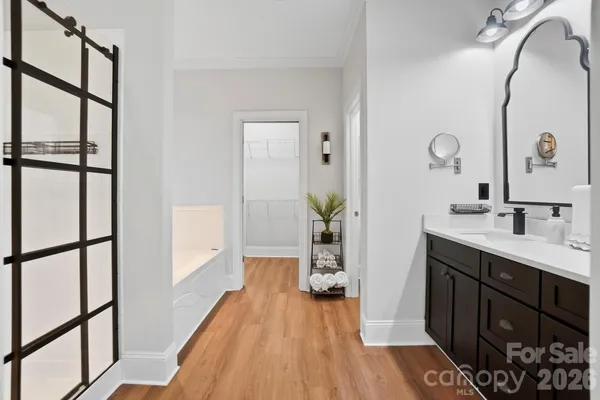 a spacious bathroom with a bathtub and a shower