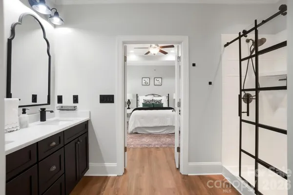 a en suite bathroom with double vanity sinks and a mirror