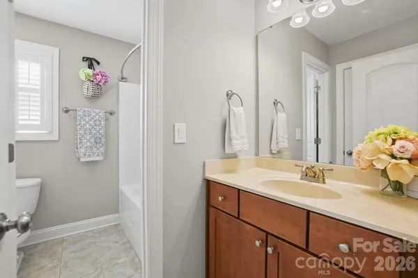a bathroom with a bath tub with a shower