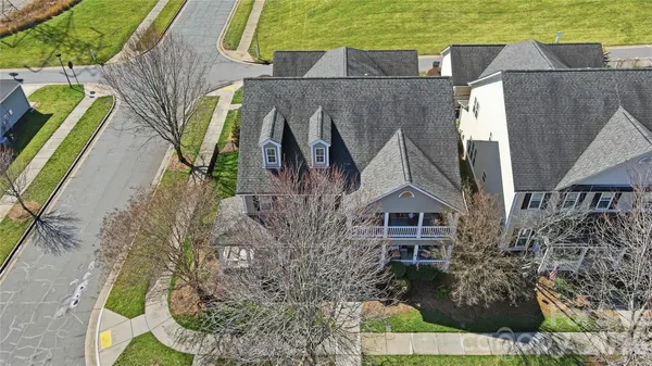 an aerial view of a house with swimming pool