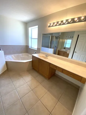 a bathroom with a bathtub and a sink