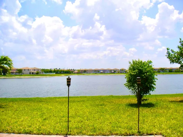 a view of a lake with a big yard
