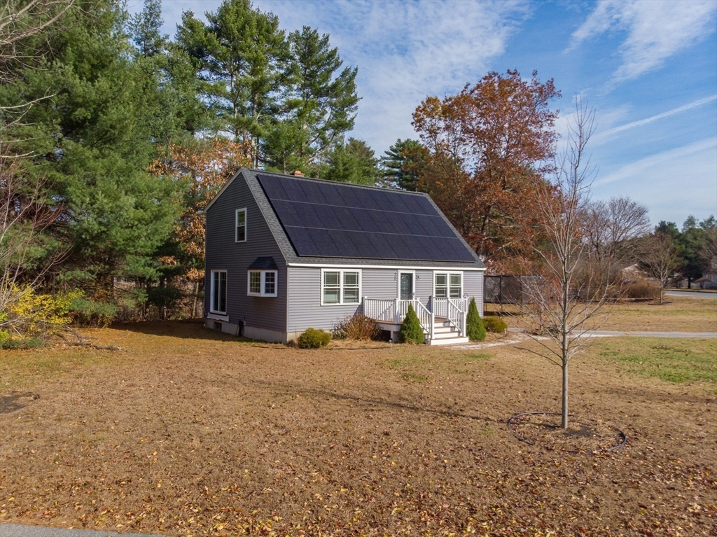 149 Dunnbrook Road East Brookfield, MA 01515 - Photo 2 of 34 a view of a house with a yard covered in snow