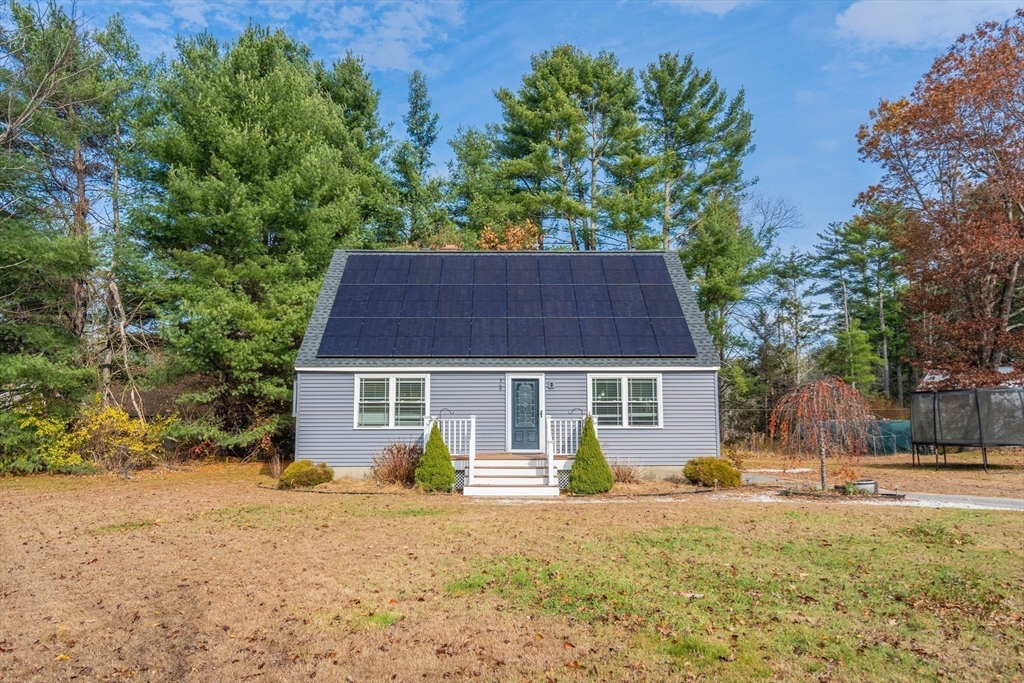 149 Dunnbrook Road East Brookfield, MA 01515 - Photo 28 of 34 a front view of a house with a yard and garage