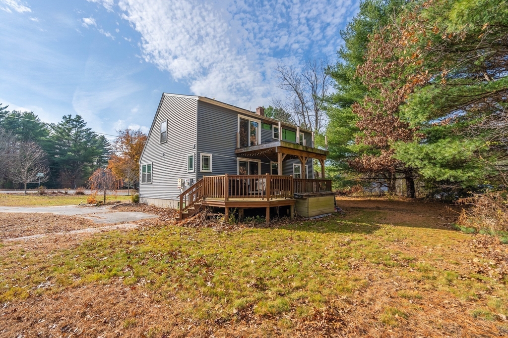 149 Dunnbrook Road East Brookfield, MA 01515 - Photo 4 of 34 a backyard of a house with table and chairs