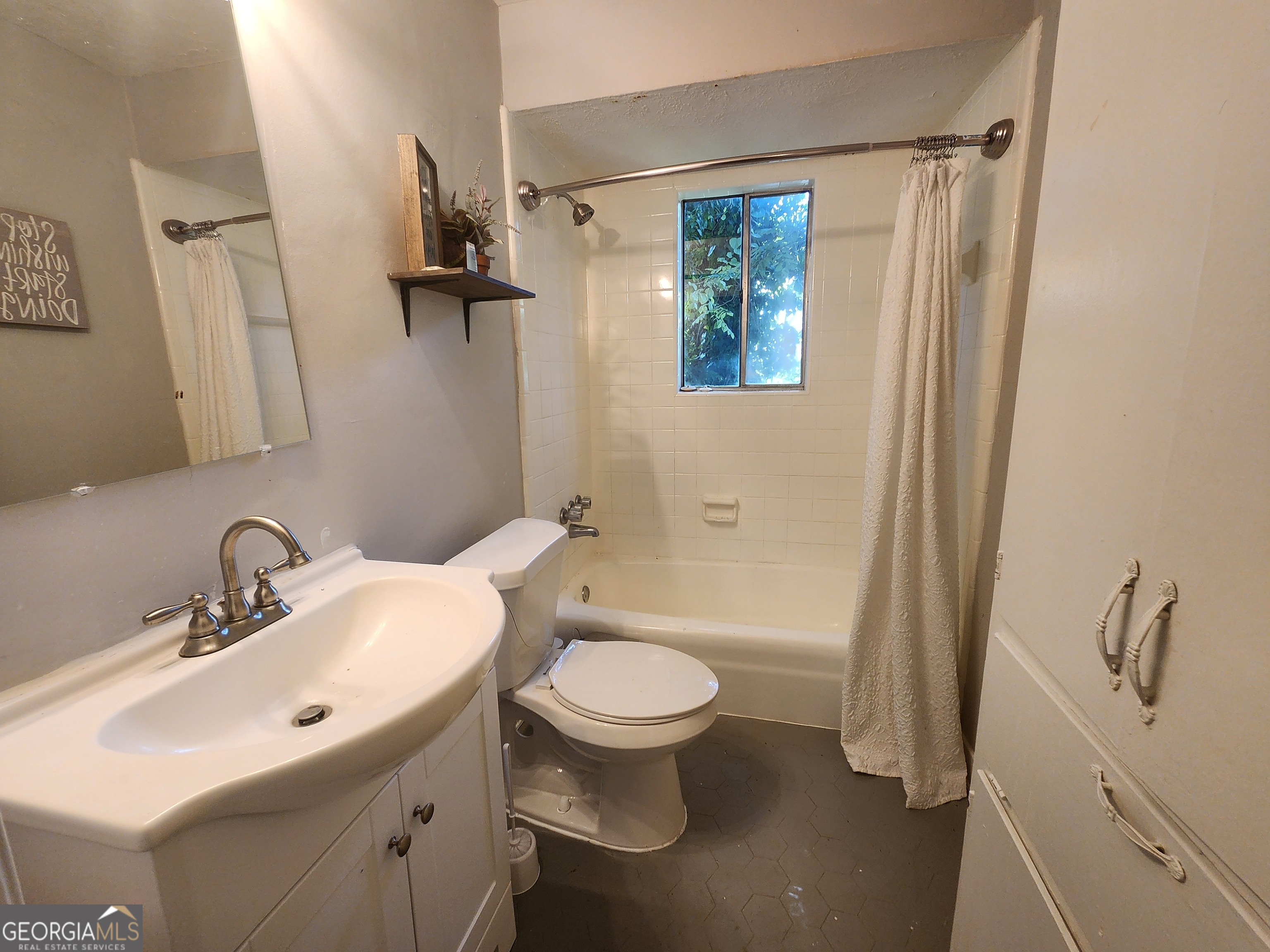 917 Oakview Avenue, Unit C Columbus, GA 31906 - Photo 3 of 14 a bathroom with a sink toilet and shower