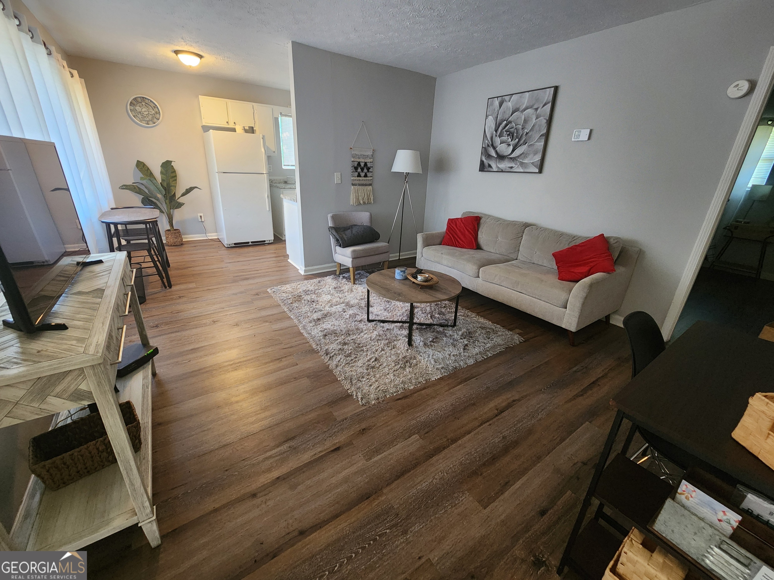 917 Oakview Avenue, Unit C Columbus, GA 31906 - Photo 7 of 14 a living room with furniture and a flat screen tv