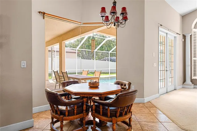 a view of a dining room with furniture window and outside view