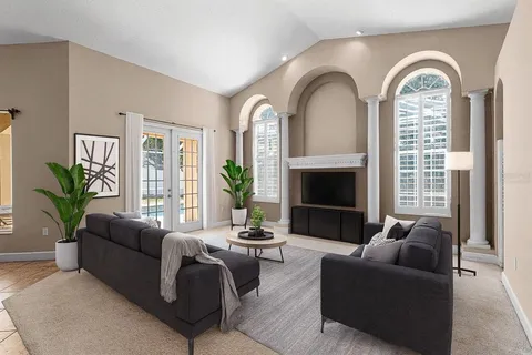 a living room with furniture and a fireplace