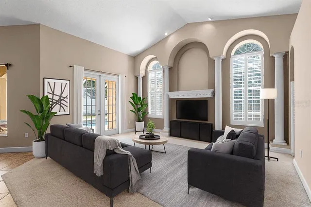 a living room with furniture and a fireplace