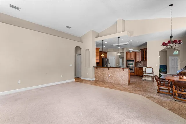 a view of a livingroom with furniture and a chandelier