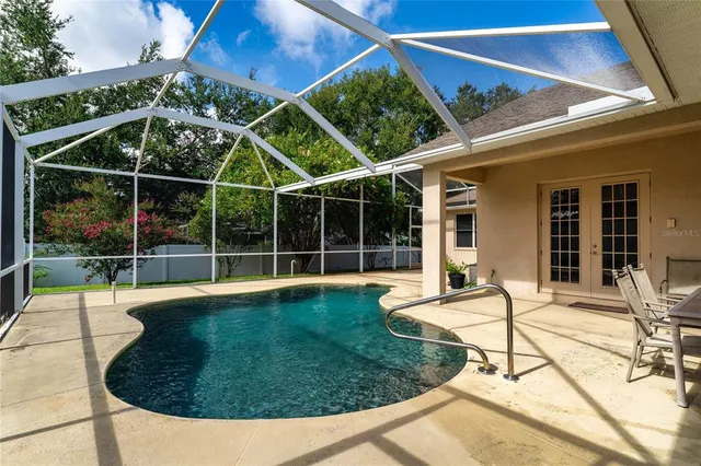 a view of a backyard with sitting area and furniture