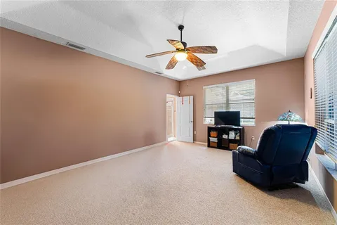 a view of livingroom with workspace and window