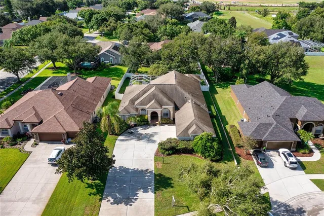 an aerial view of a house with a garden
