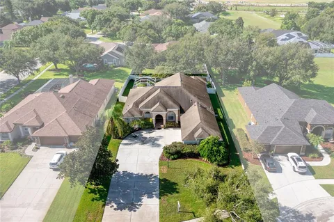 an aerial view of a house with a garden