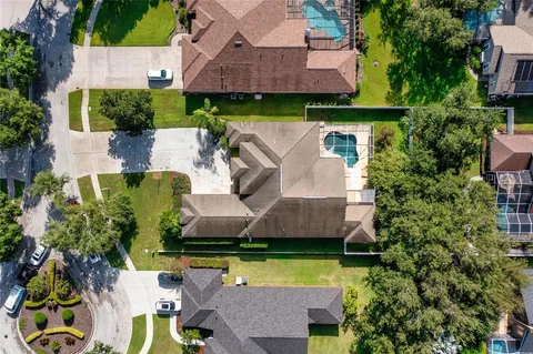 an aerial view of a house with swimming pool