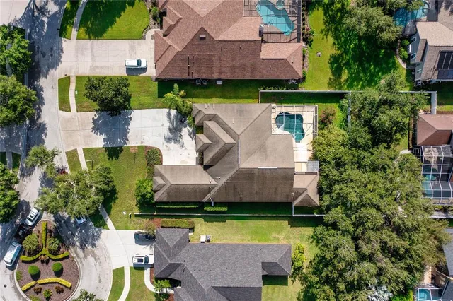 an aerial view of a house with swimming pool