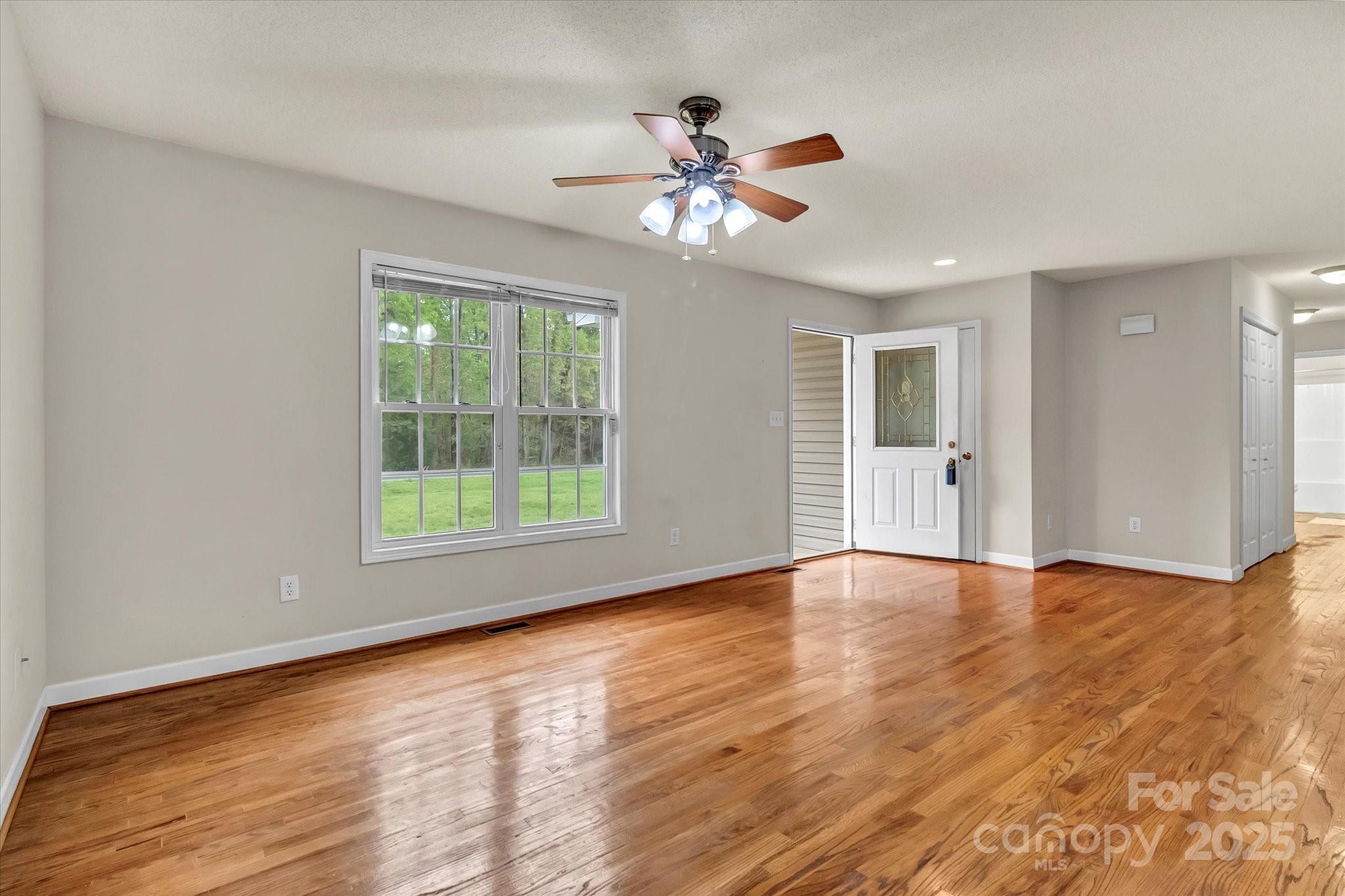 4773 Westwinds Road Lincolnton, NC 28092 - Photo 12 of 38 a view of an empty room with wooden floor and a window