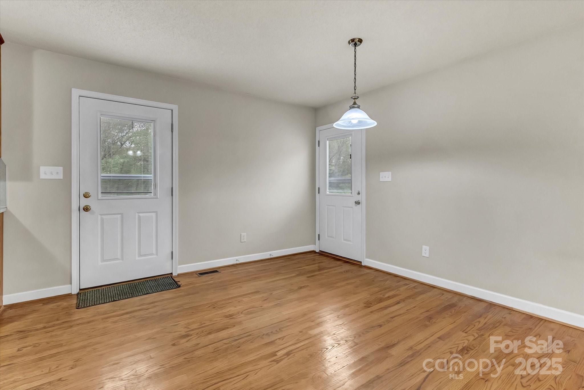 4773 Westwinds Road Lincolnton, NC 28092 - Photo 13 of 38 a view of a room with window wooden floor and white walls