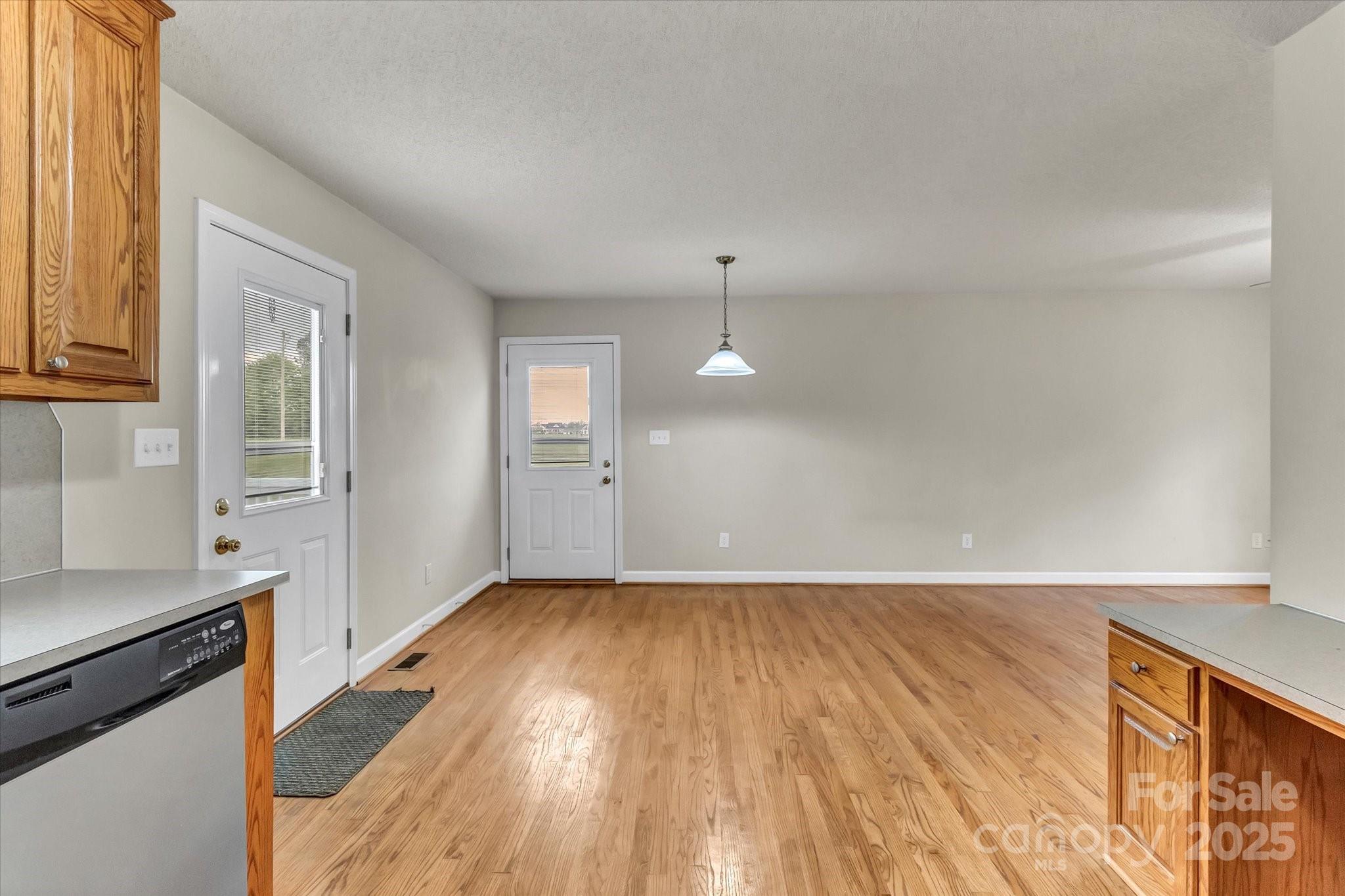 4773 Westwinds Road Lincolnton, NC 28092 - Photo 14 of 38 an empty room with wooden floor and windows