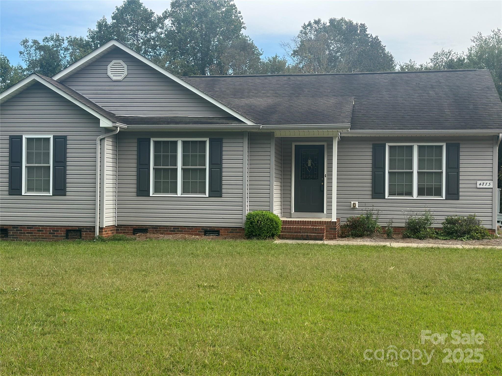 4773 Westwinds Road Lincolnton, NC 28092 - Photo 2 of 38 a view of a house with a garden and yard