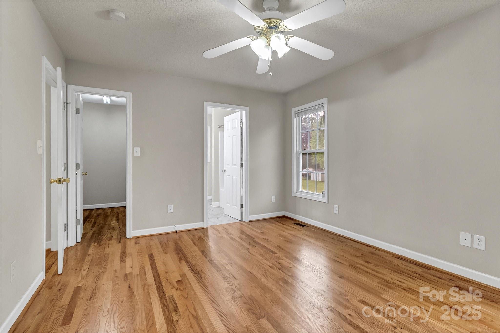 4773 Westwinds Road Lincolnton, NC 28092 - Photo 24 of 38 a view of an empty room with wooden floor and a window