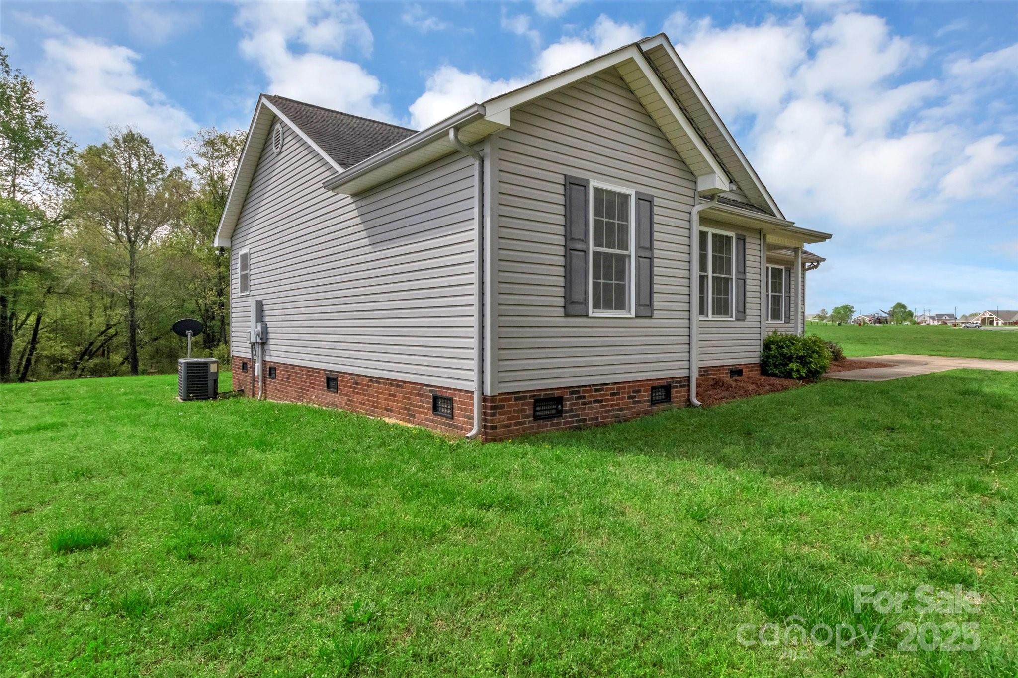 4773 Westwinds Road Lincolnton, NC 28092 - Photo 3 of 38 a front view of a house with a yard