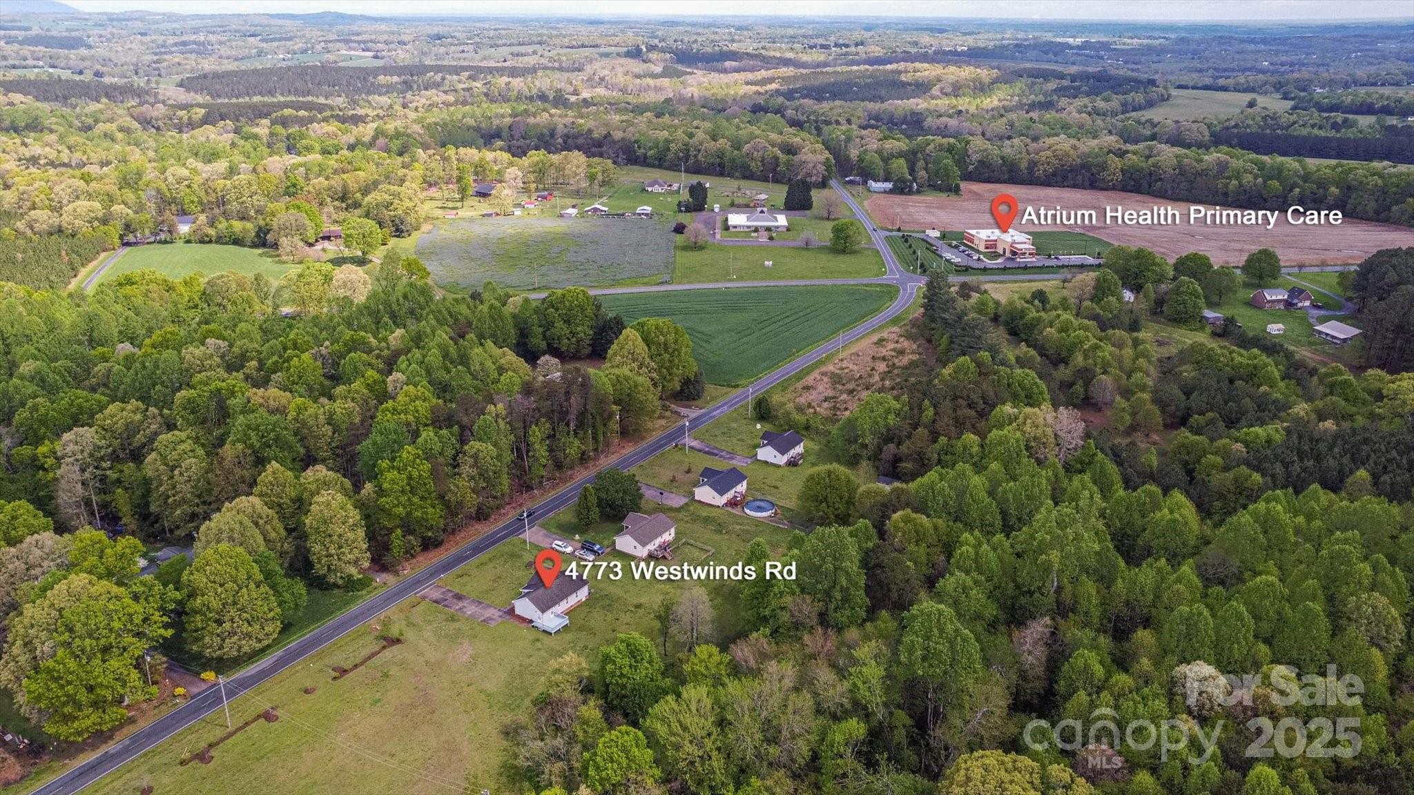 4773 Westwinds Road Lincolnton, NC 28092 - Photo 37 of 38 a view of a city with lush green forest