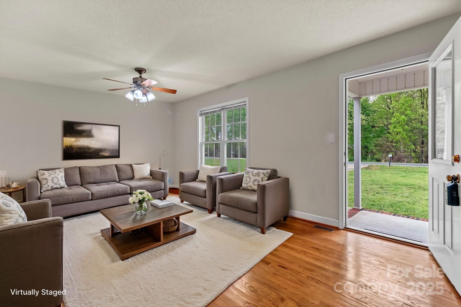 4773 Westwinds Road Lincolnton, NC 28092 - Photo 10 of 38 a living room with furniture and a flat screen tv
