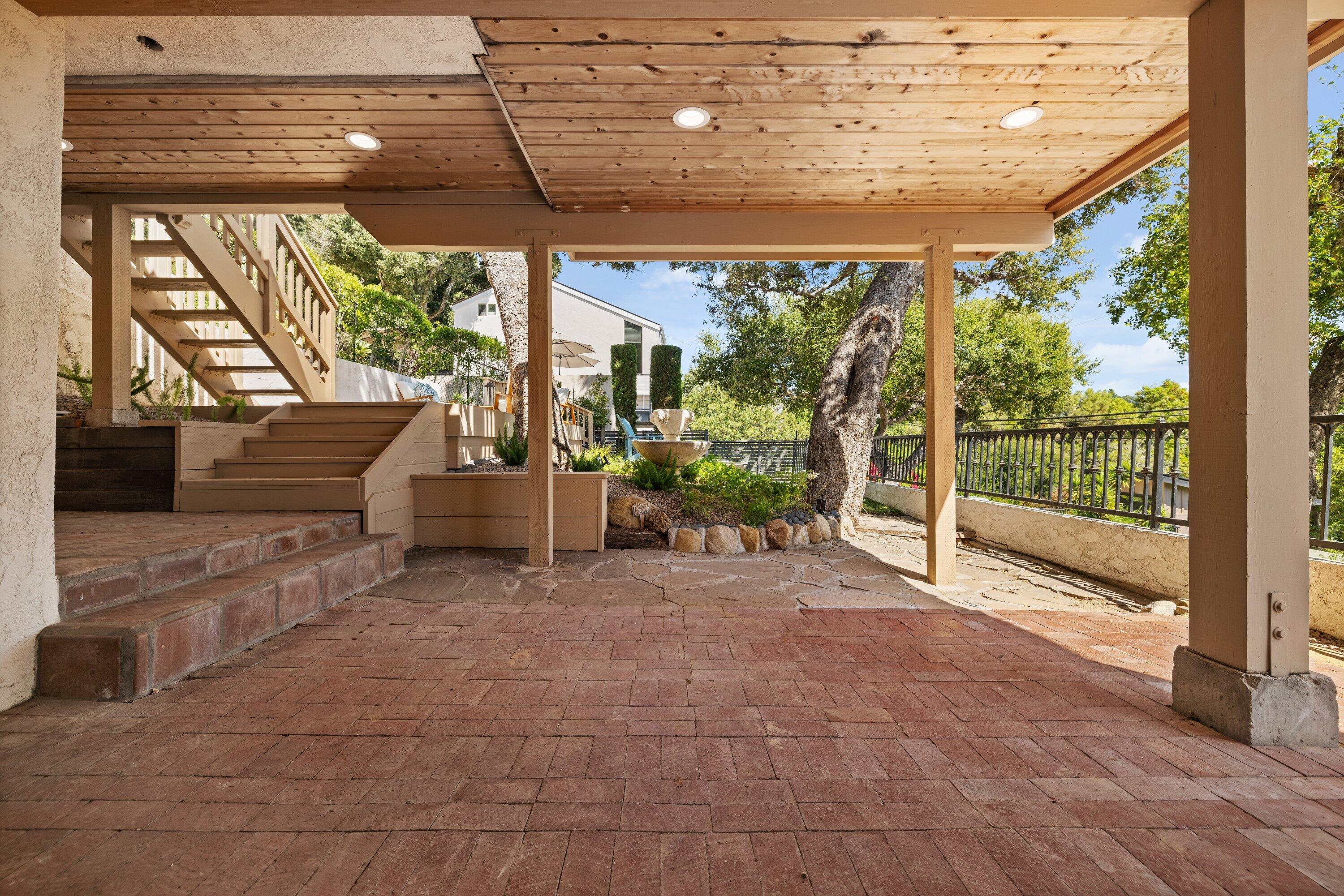 844 Cheltenham Road Santa Barbara, CA 93105 - Photo 13 of 31 a view of a porch with furniture and garden