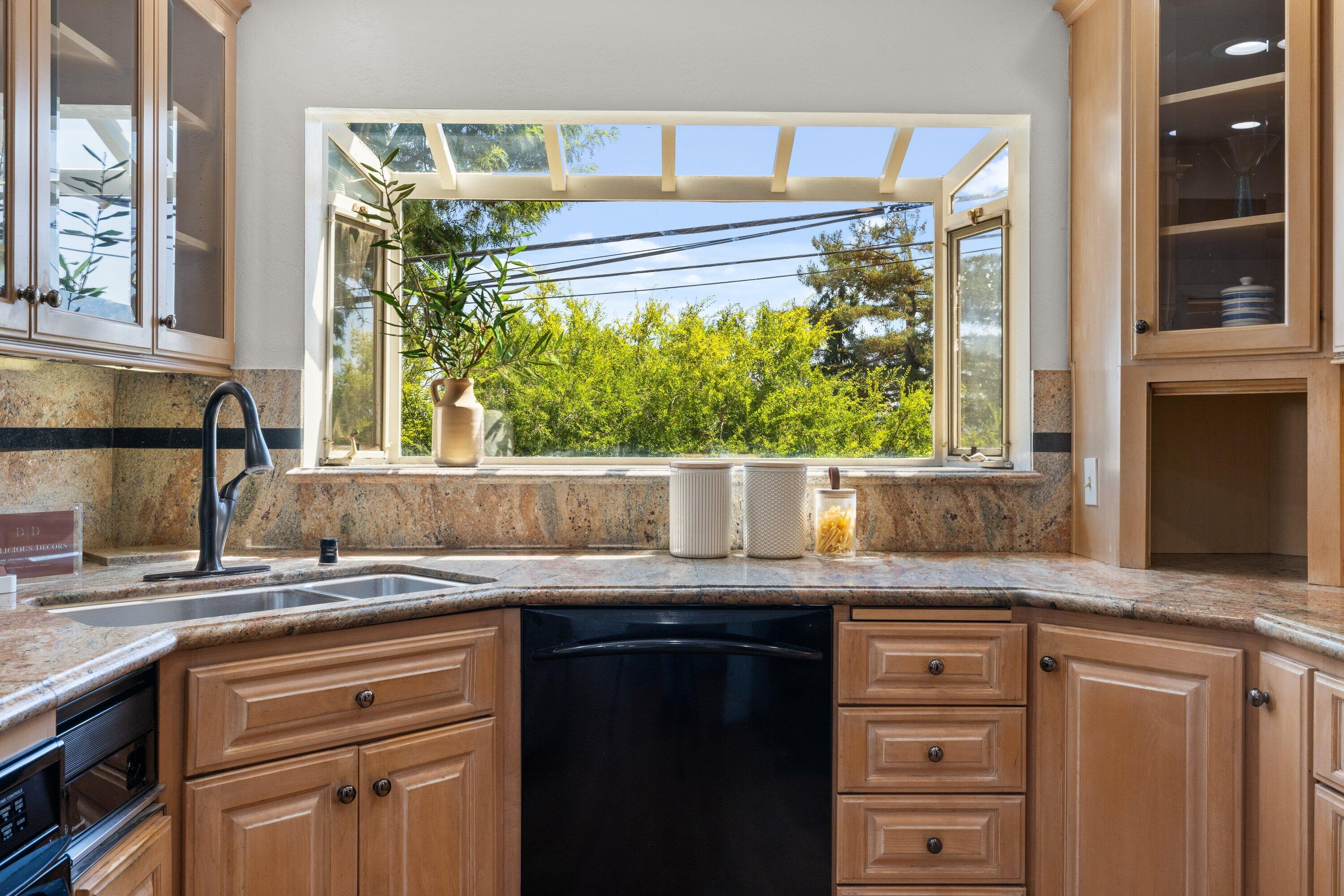 844 Cheltenham Road Santa Barbara, CA 93105 - Photo 8 of 31 a kitchen with granite countertop a sink and a stove