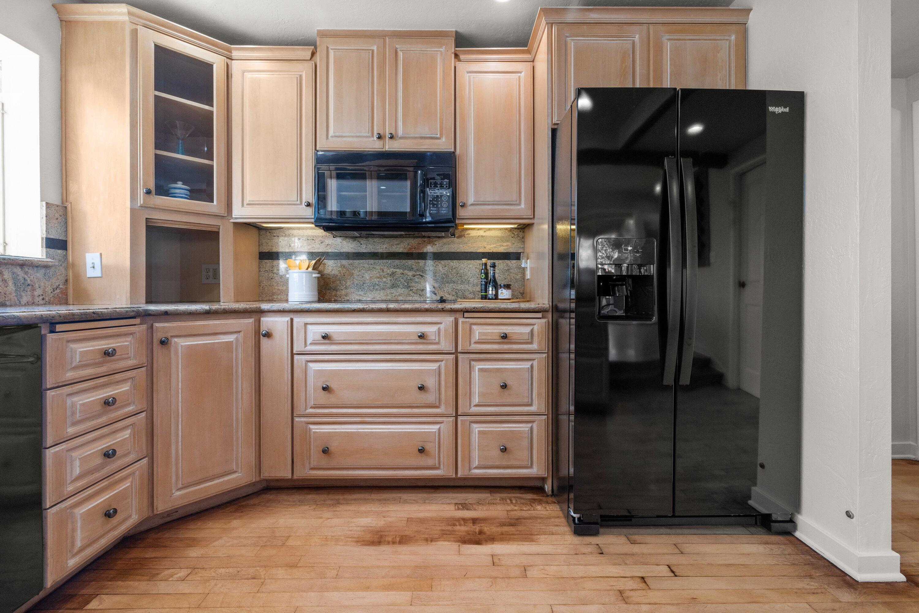 844 Cheltenham Road Santa Barbara, CA 93105 - Photo 9 of 31 a kitchen with stainless steel appliances a stove and a microwave