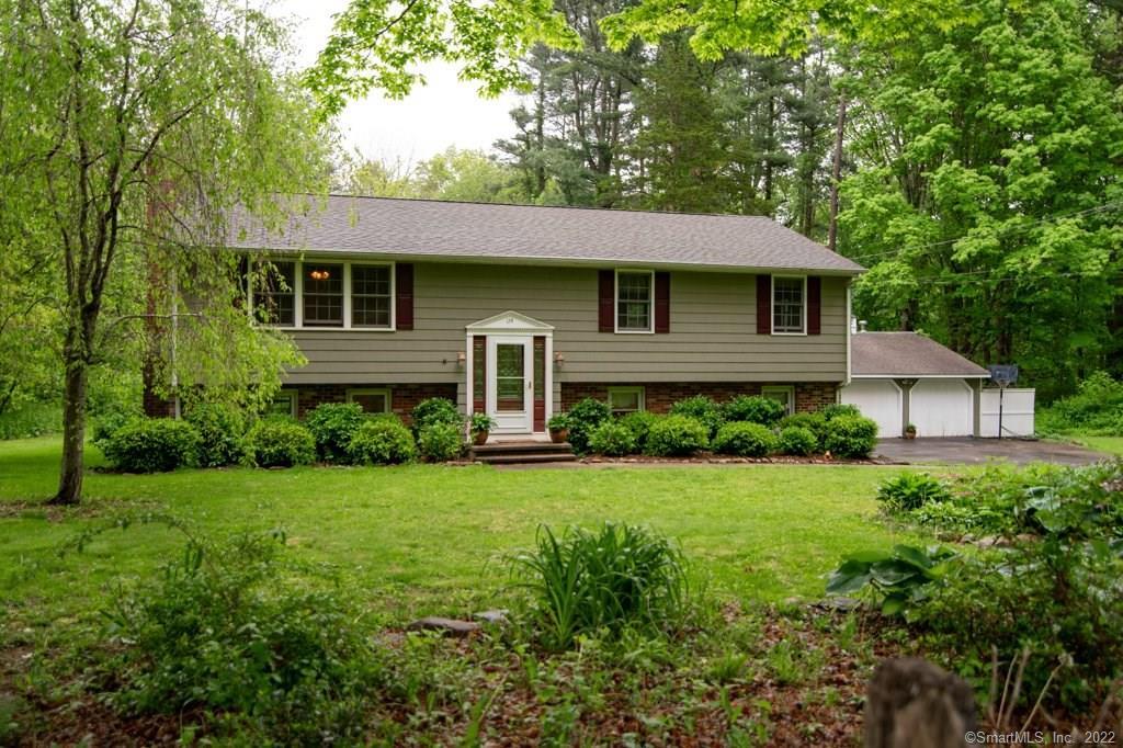 174 Nortontown Road Madison, CT 06443 - Photo 1 of 1 a front view of a house with a yard