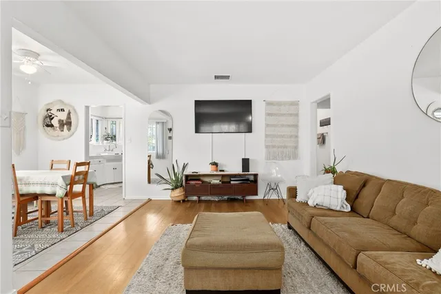 a view of a dining room with furniture and a window