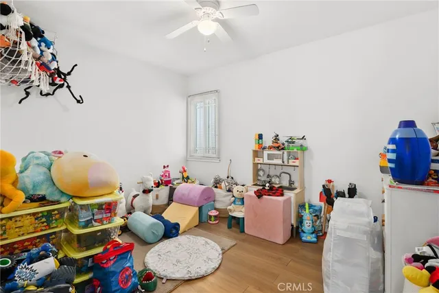 a view of a workspace with furniture and a flat screen tv