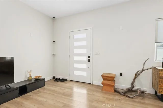 a bedroom with bed and tv