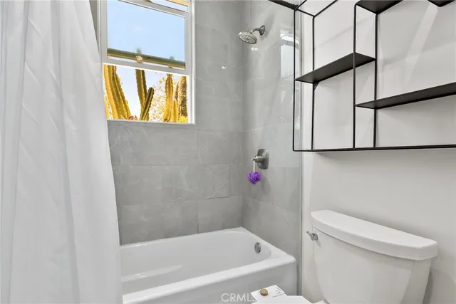 a view of a chair and tables back yard of the house